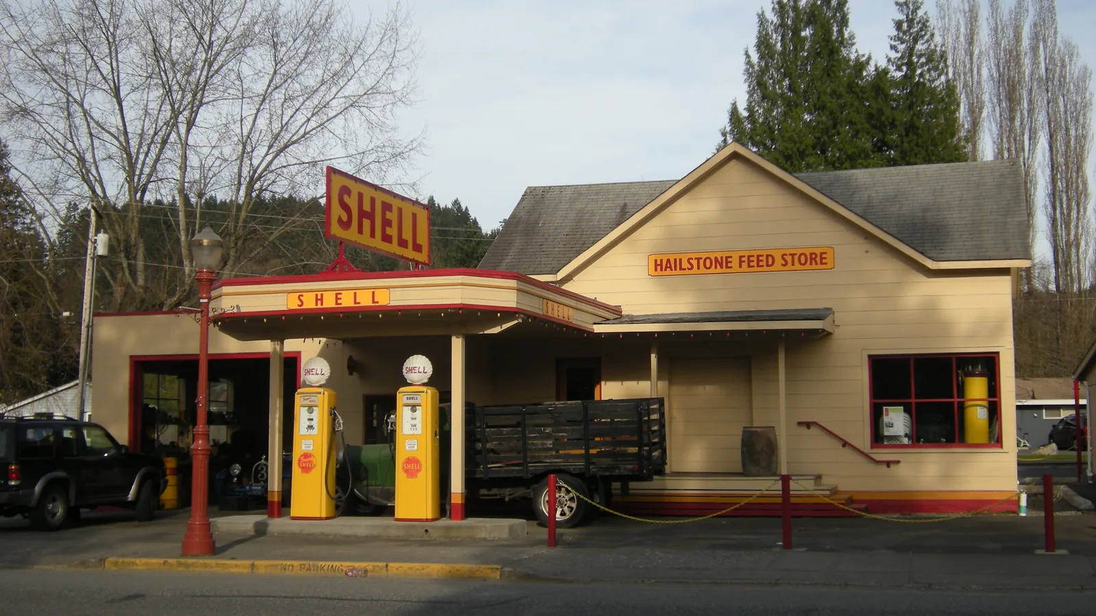 The old Hailstone Feed Store, a red wooden building with a false front on a downtown Issaquah street.