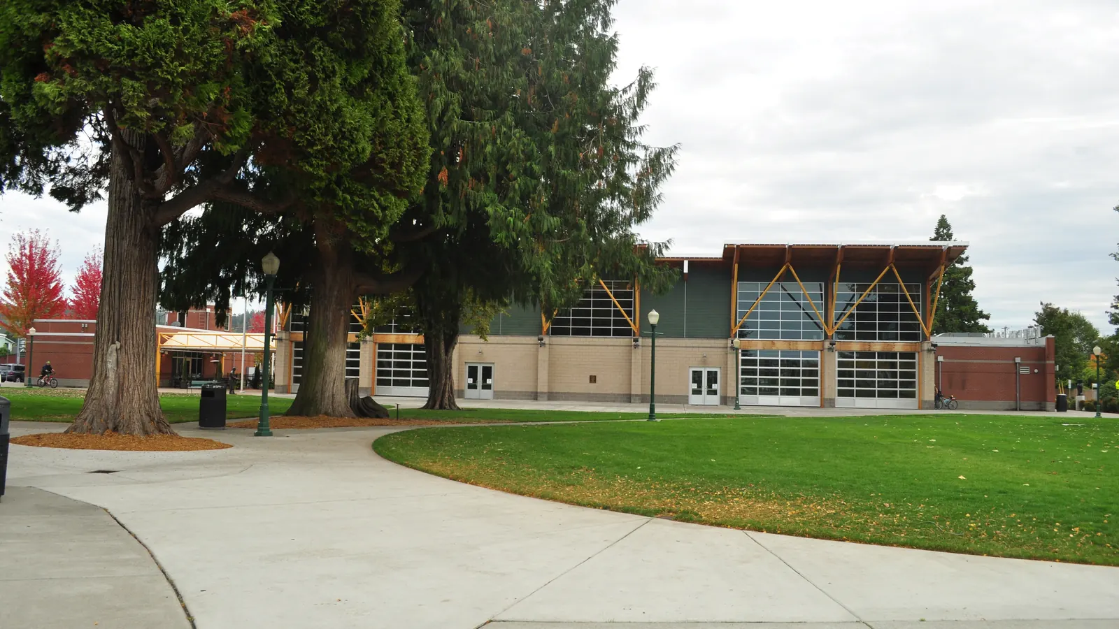 The pavilion at Pioneer Park in Puyallup, with a lawn and trees.