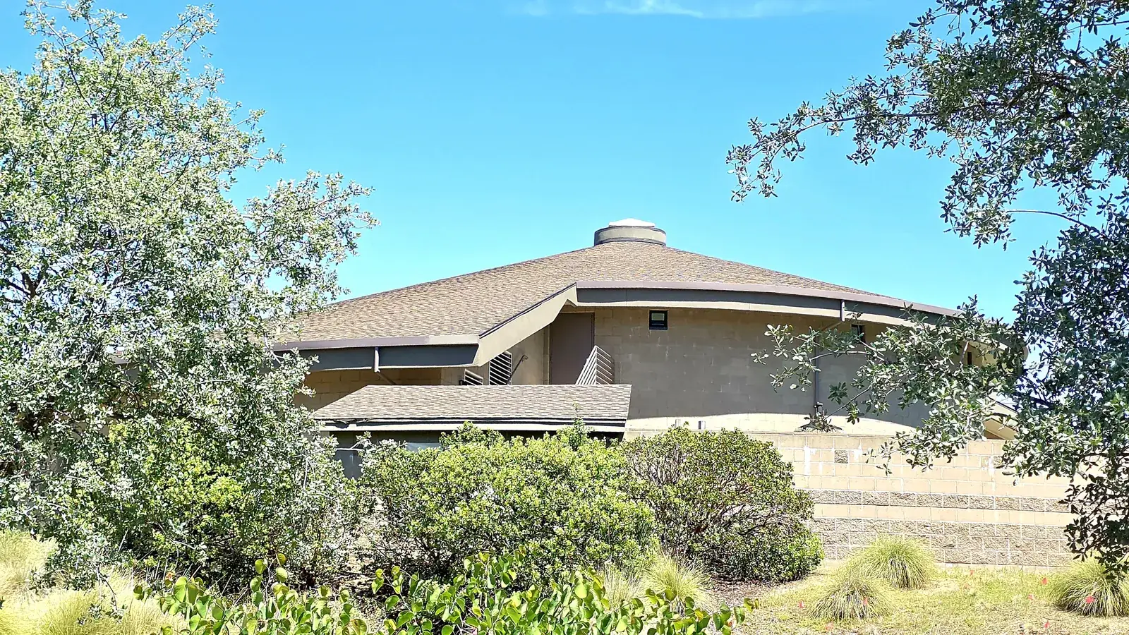 The Maidu Museum and Historic Site, a round earth-toned building with a grass-covered roof.