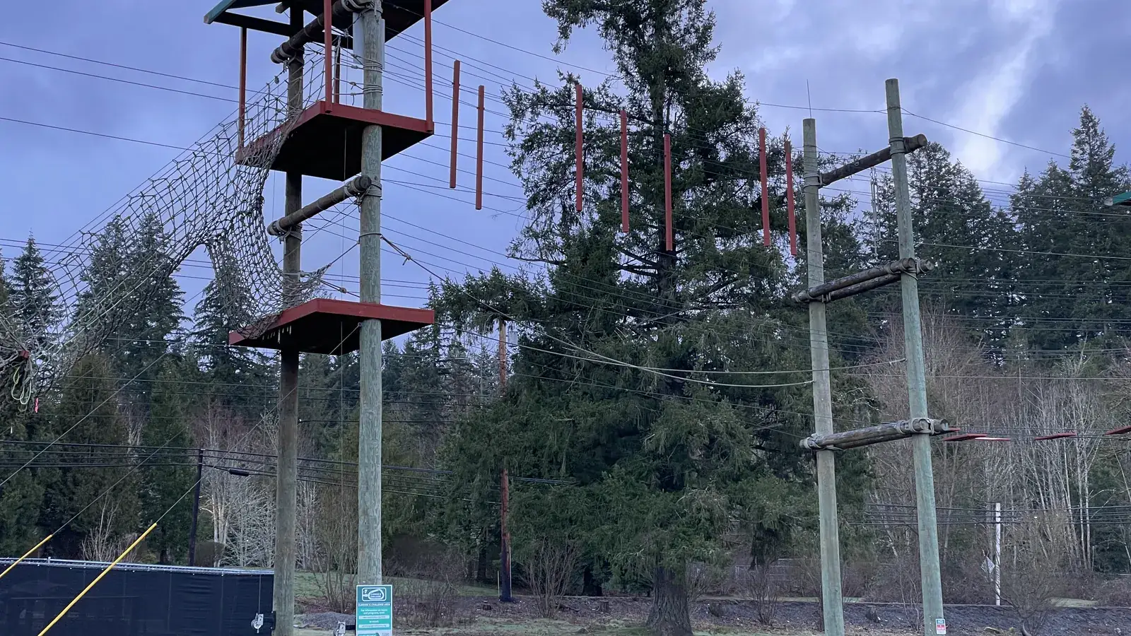 A playground and a covered picnic shelter beside Cottage Lake at Cottage Lake Park in Woodinville.